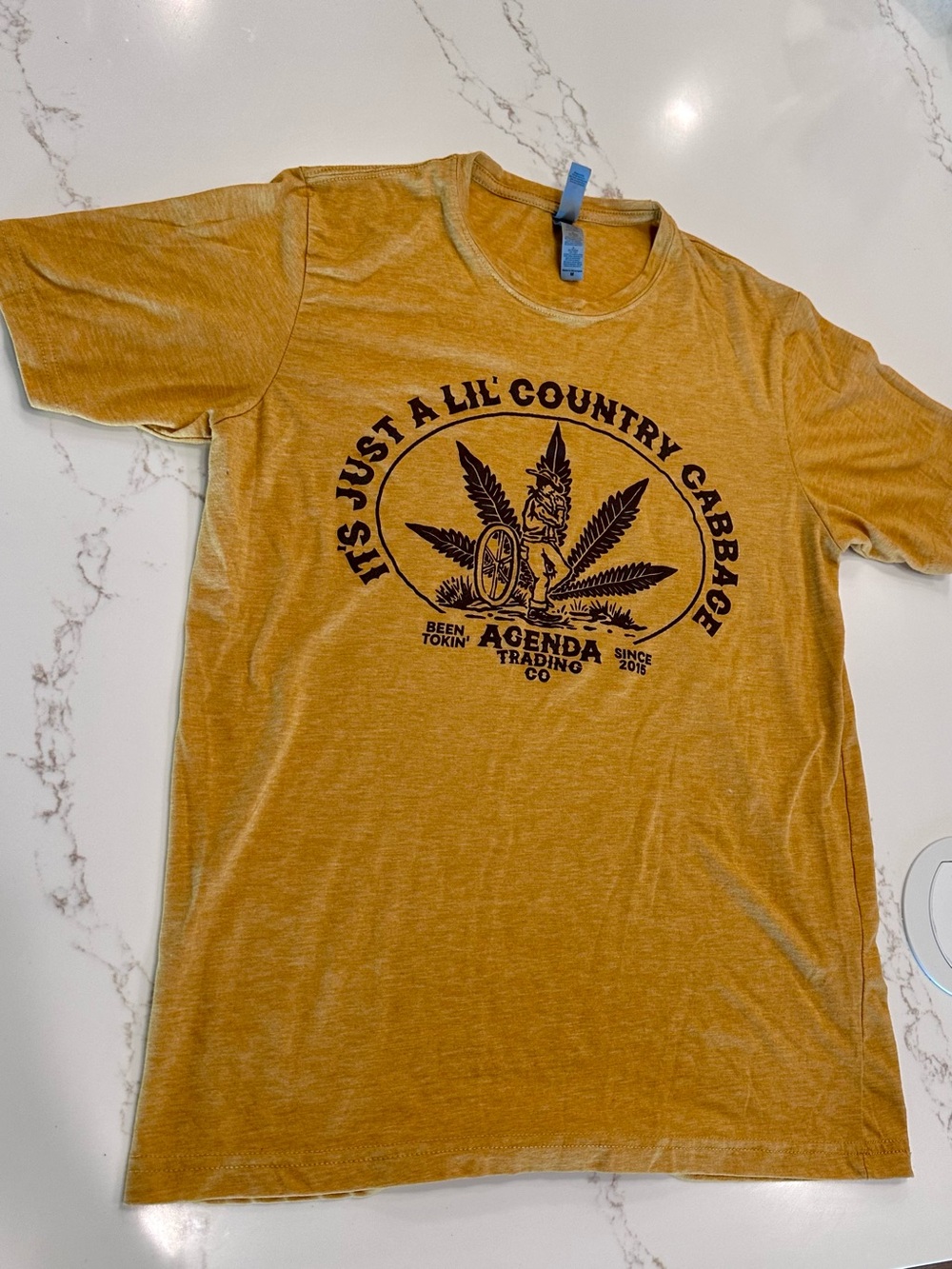 Next Level Apparel Mustard Tee with Brown Graphic